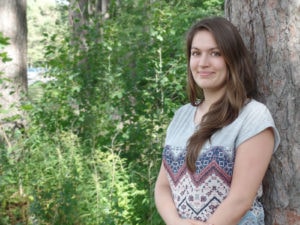 Jana Murphy next to a tree