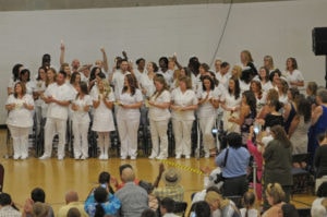 Large group of nurses celebrating after taking their pledge