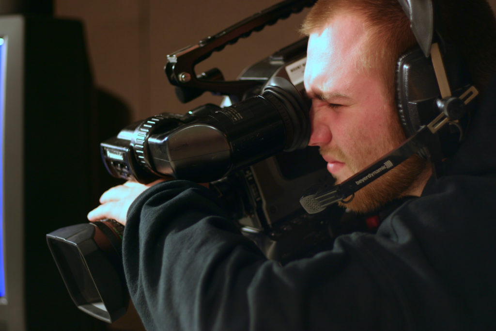 Media Arts & Technology - Video Student using a Camera
