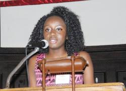 Plamedi Makelela speaking at a podium