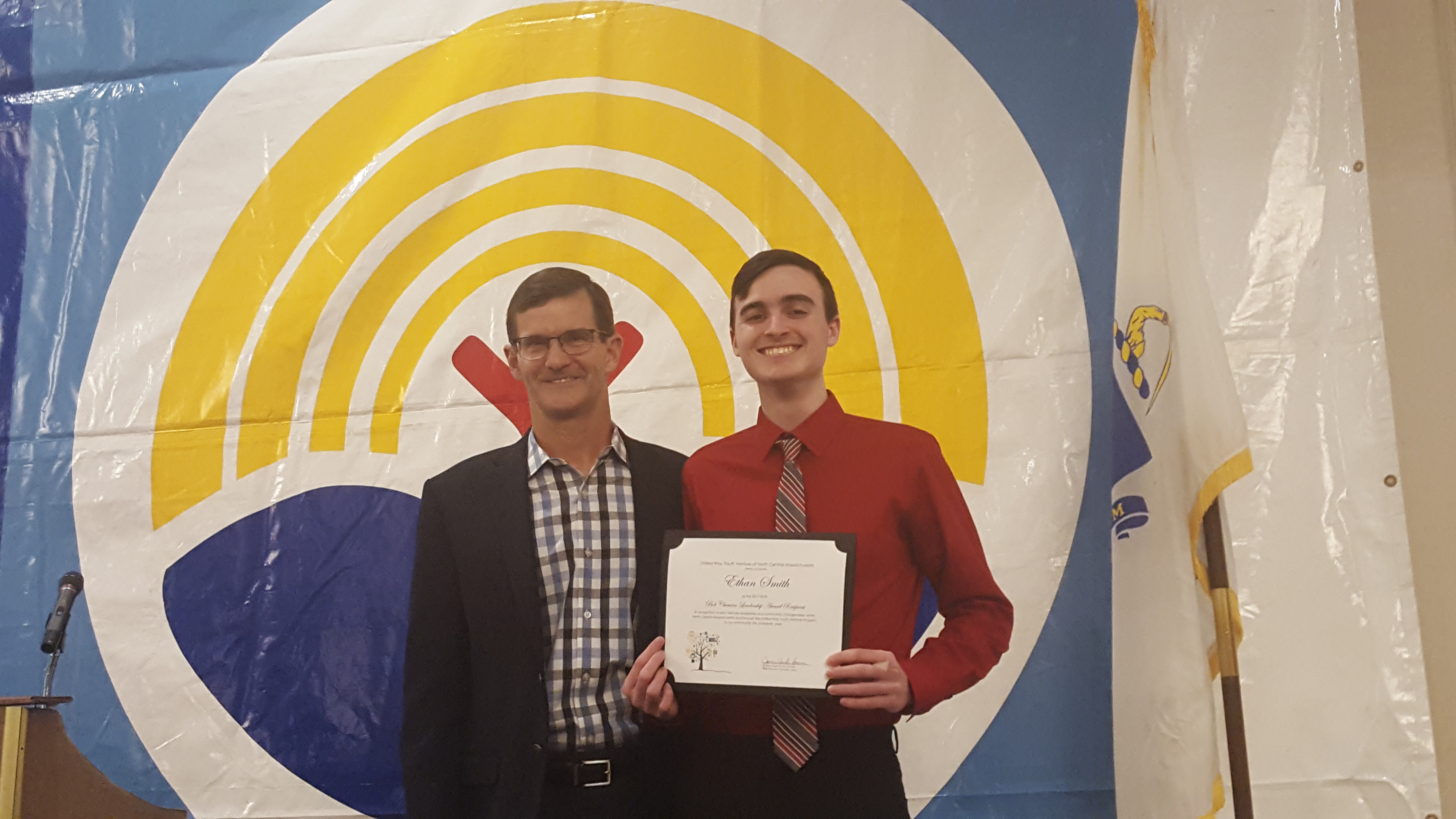 Ethan Smith with his scholarship certificate, with Bob Chauvin