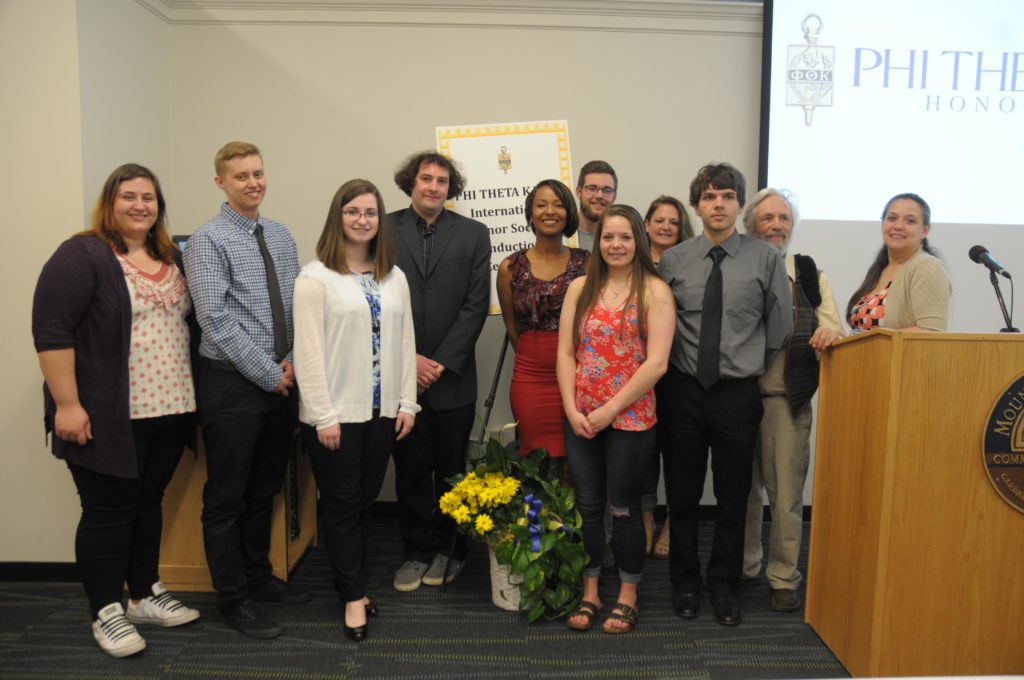 A group of people poses for a photo.