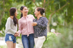 Three females talking and laughing (mother and two daughters)