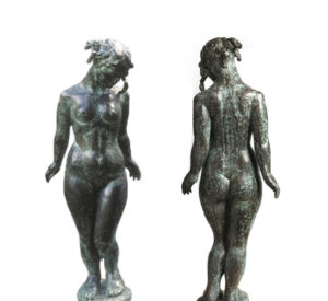 A bronze sculpture is pictured front and back.