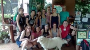 MWCC students and staff pose for picture with dog at Monkey Sanctuary in Costa Rica