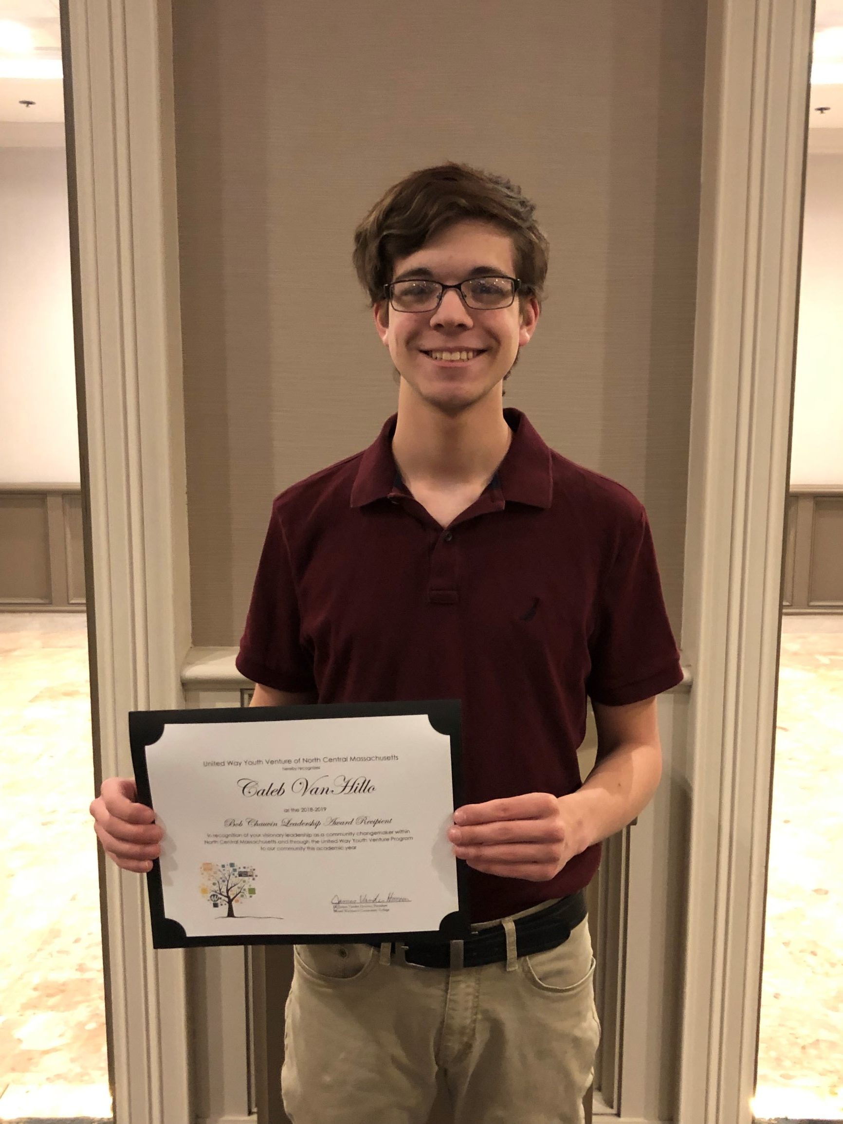 Ethan Smith with his scholarship certificate, with Bob Chauvin