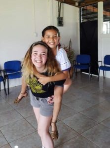 Photo of Araya with school child in Costa Rica