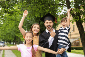 Adult student parent graduate with family