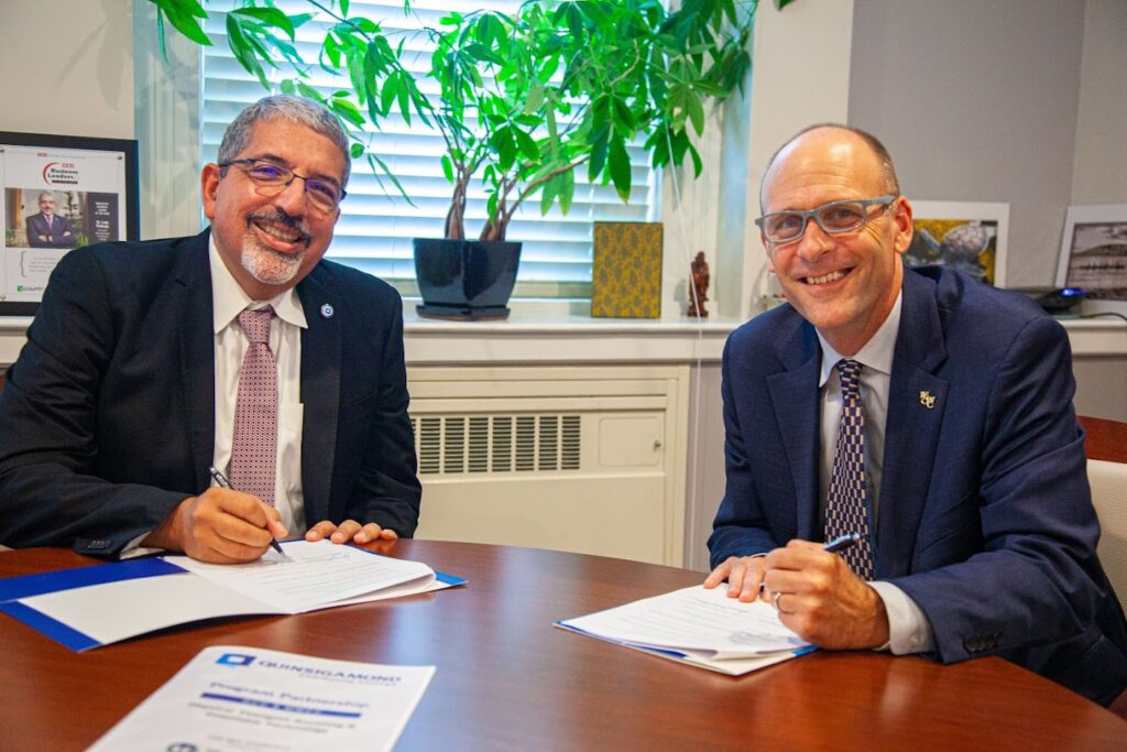 QCC President Luis G. Pedraja, Ph.D. and MWCC President James L. Vander Hooven, Ed.D.