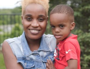 MWCC Student and First Literacy Scholarship Honoree Hajarah Nakalyango and son