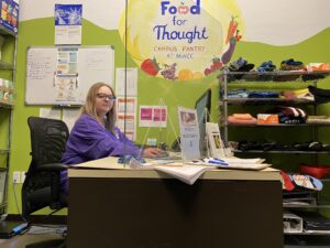 Student Adriana Buzzell working at the Food Pantry