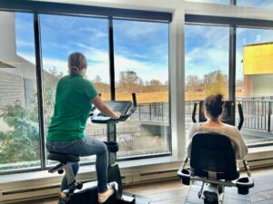 Staff members Sarah Savoie and Stephanie England utilizing grant funded stationery bikes