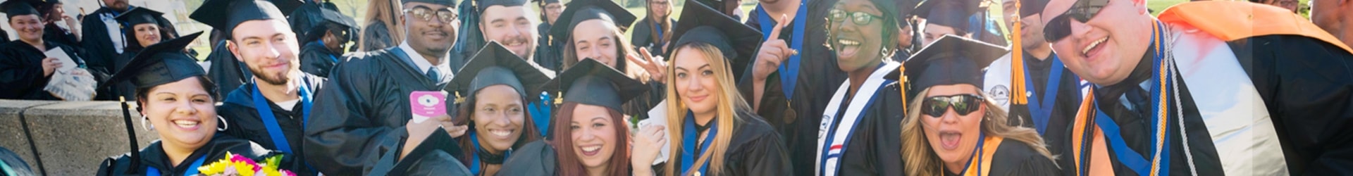 Group of happy graduates at commencement