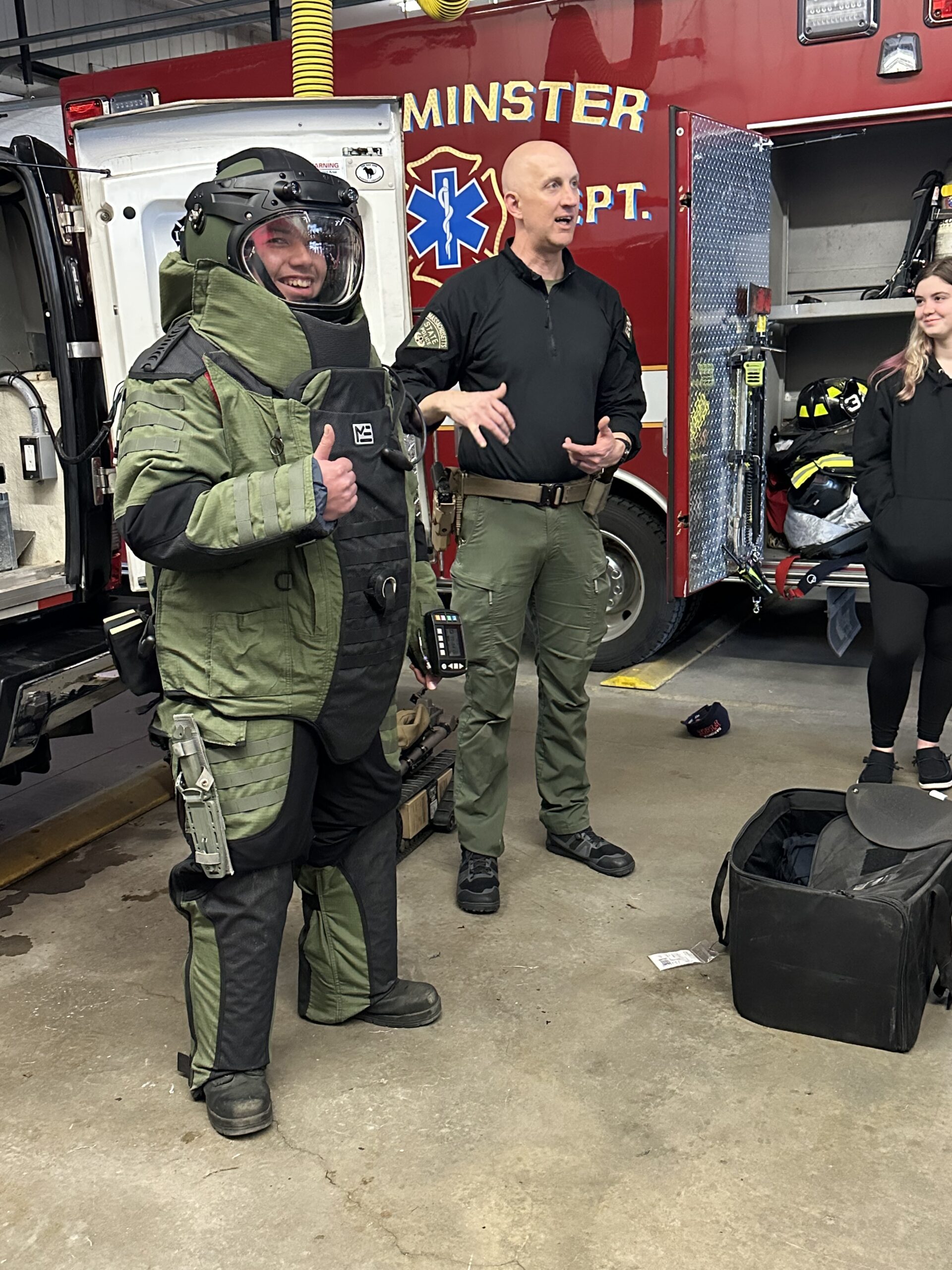 Student wearing EOD suit with State Police Sgt