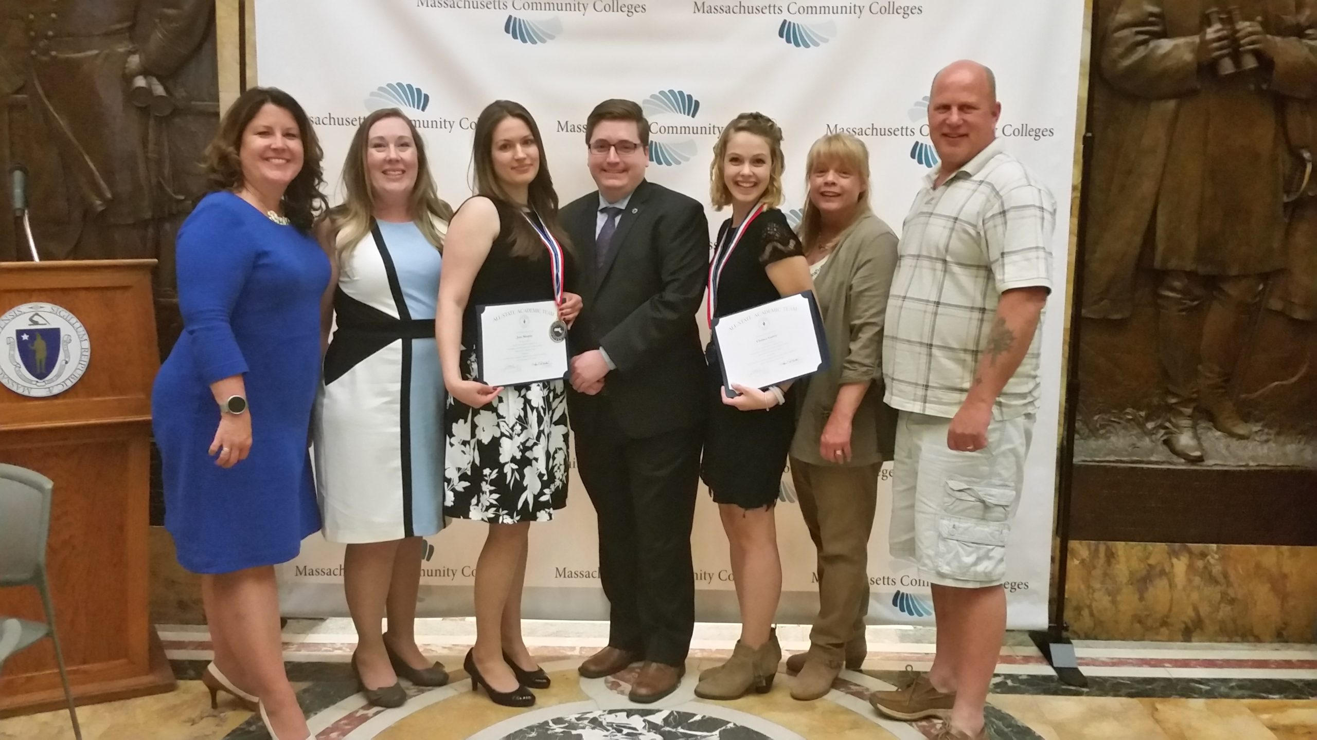 left to right: Vice President Lea Ann Scales, Director Fagan Forhan, Honoree Jana Murphy, State Representative Jon Zlotnik, Honoree Chelsea Garrity, and her parents