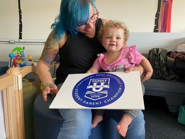 Student-parent Corinne Howard cares for Sophia Douglass in the MWCC Family Resource Center while her mother Millie Bousbaa, a Criminal Justice major, is in class. Howard is a College Ambassador in the MWCC Child Watch Program and an Early Childhood Education major.