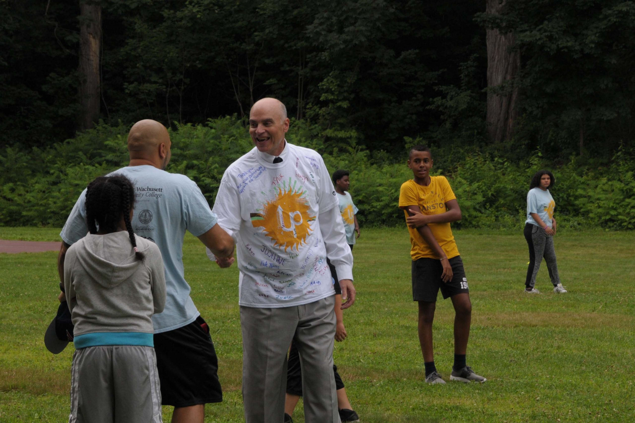 Doug Petersen shaking hands with a counselor