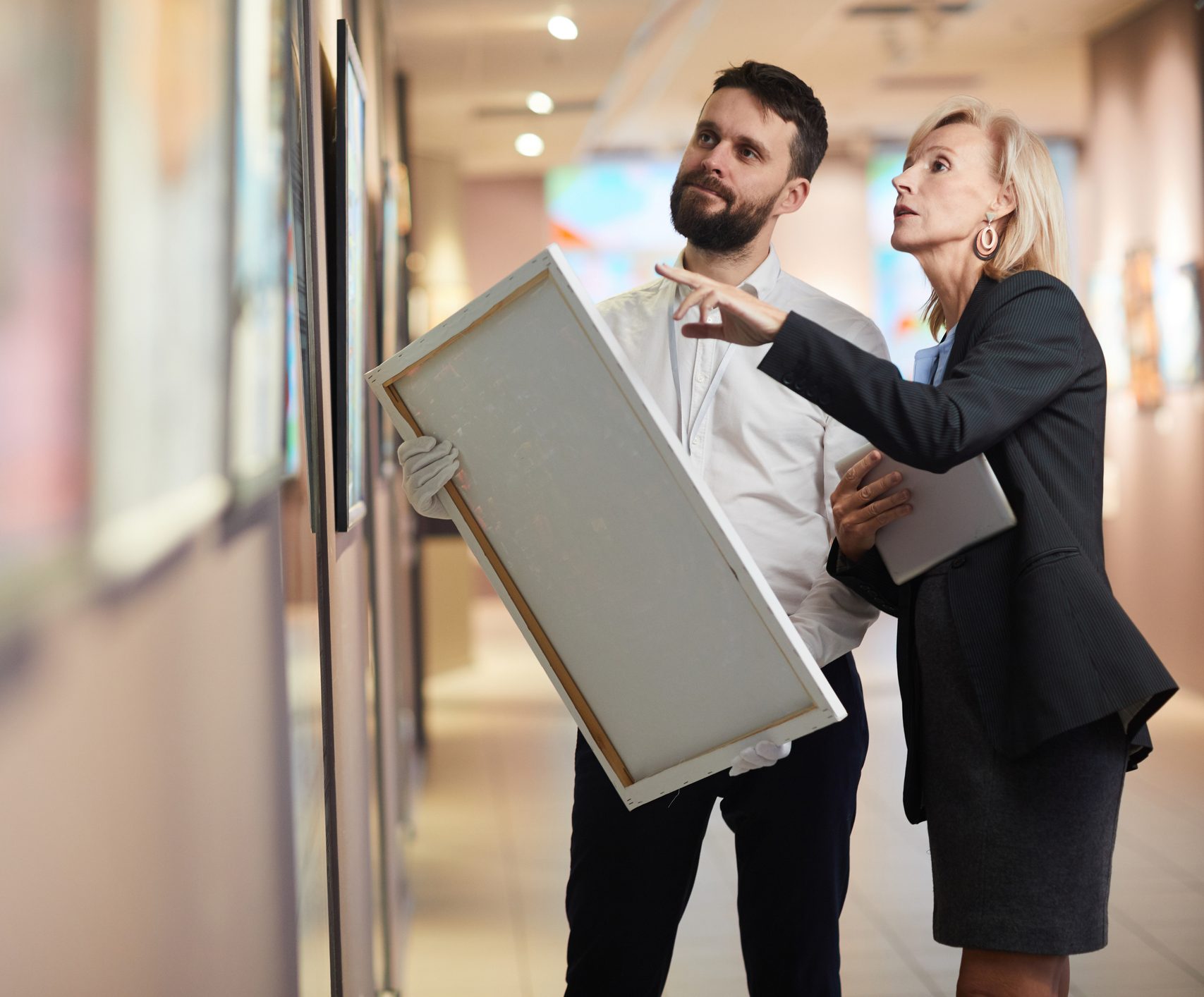 Businesswoman Buying Painting in Art Gallery
