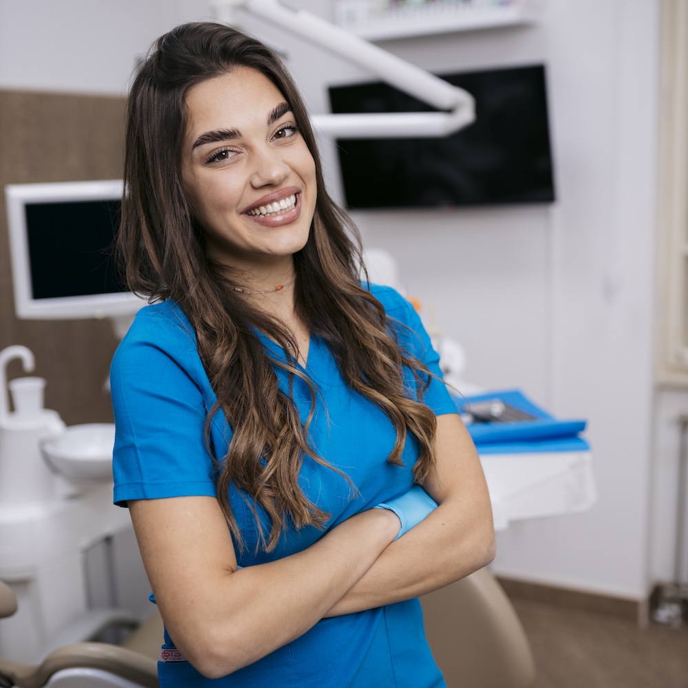 Portrait of confident female dental doctor at dental hospital