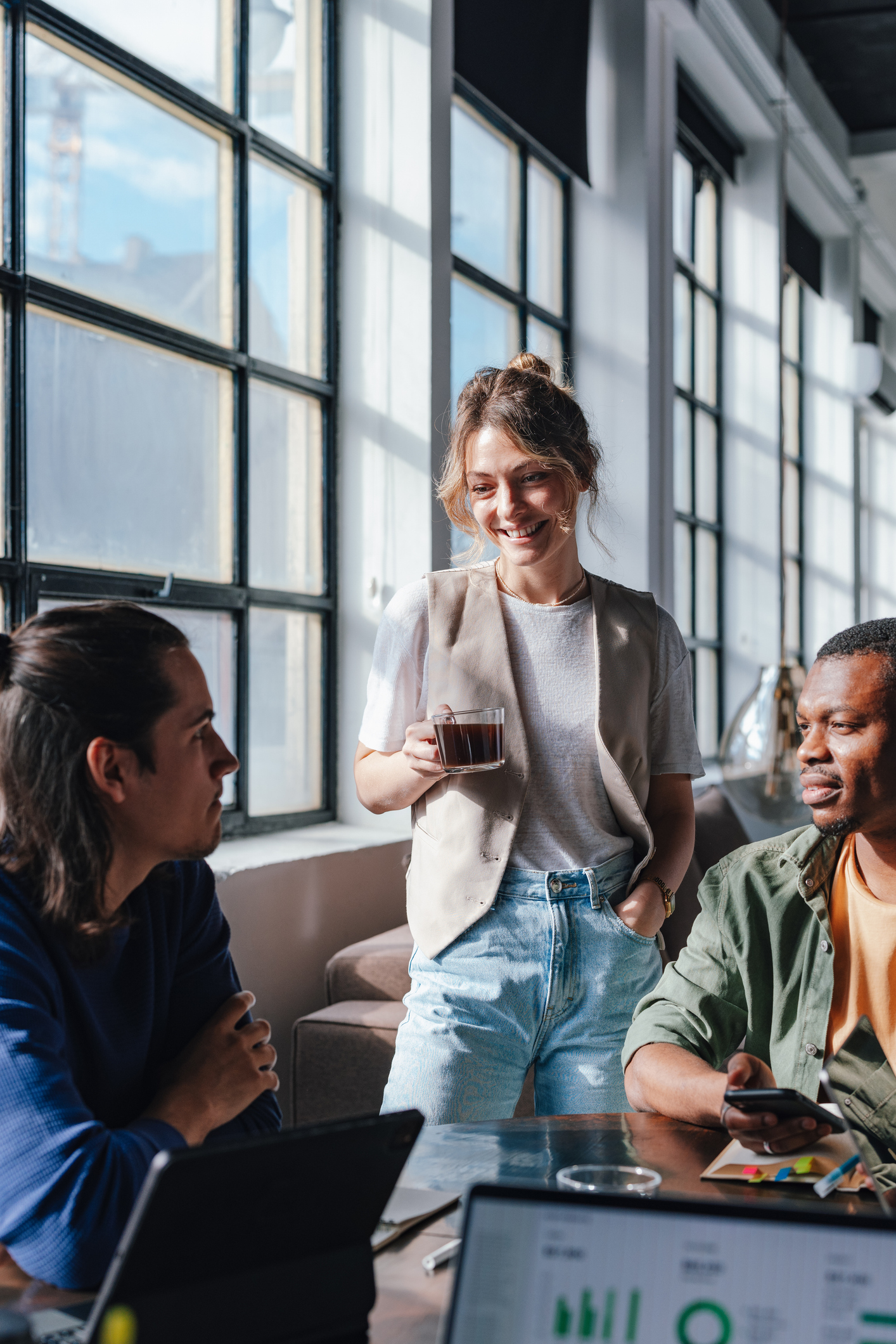 Young Professionals Collaborating in Bright Co-Working Space