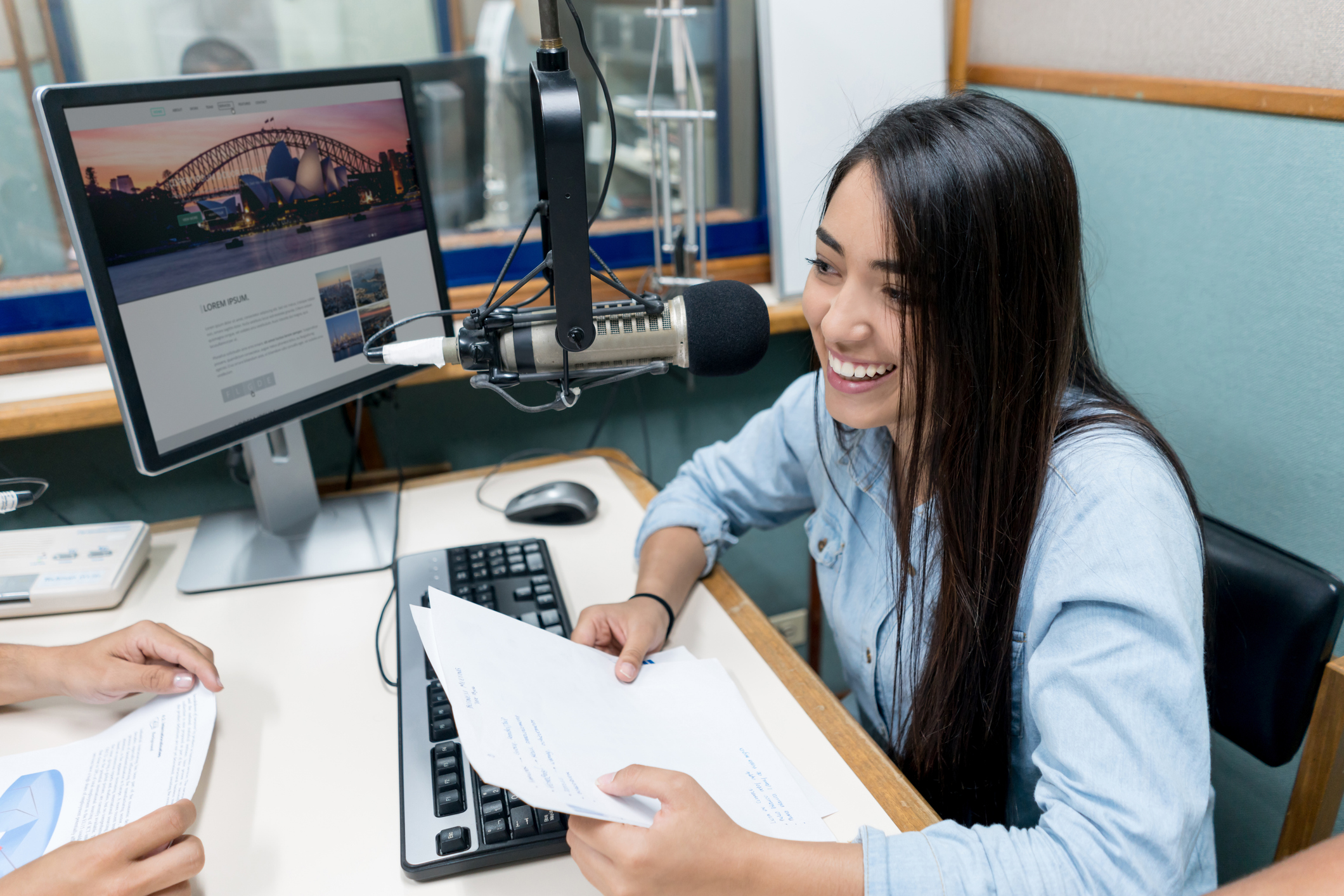 Female student broadcasting from the university’s radio station
