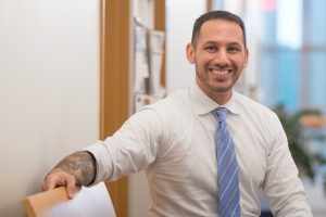 A man smiles in a photo.