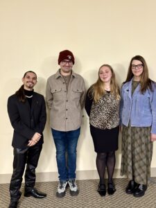 Students Brandon Russo-Serrano, Ben Miner, and Kiarah Moore with Librarian Ellen Pratt.