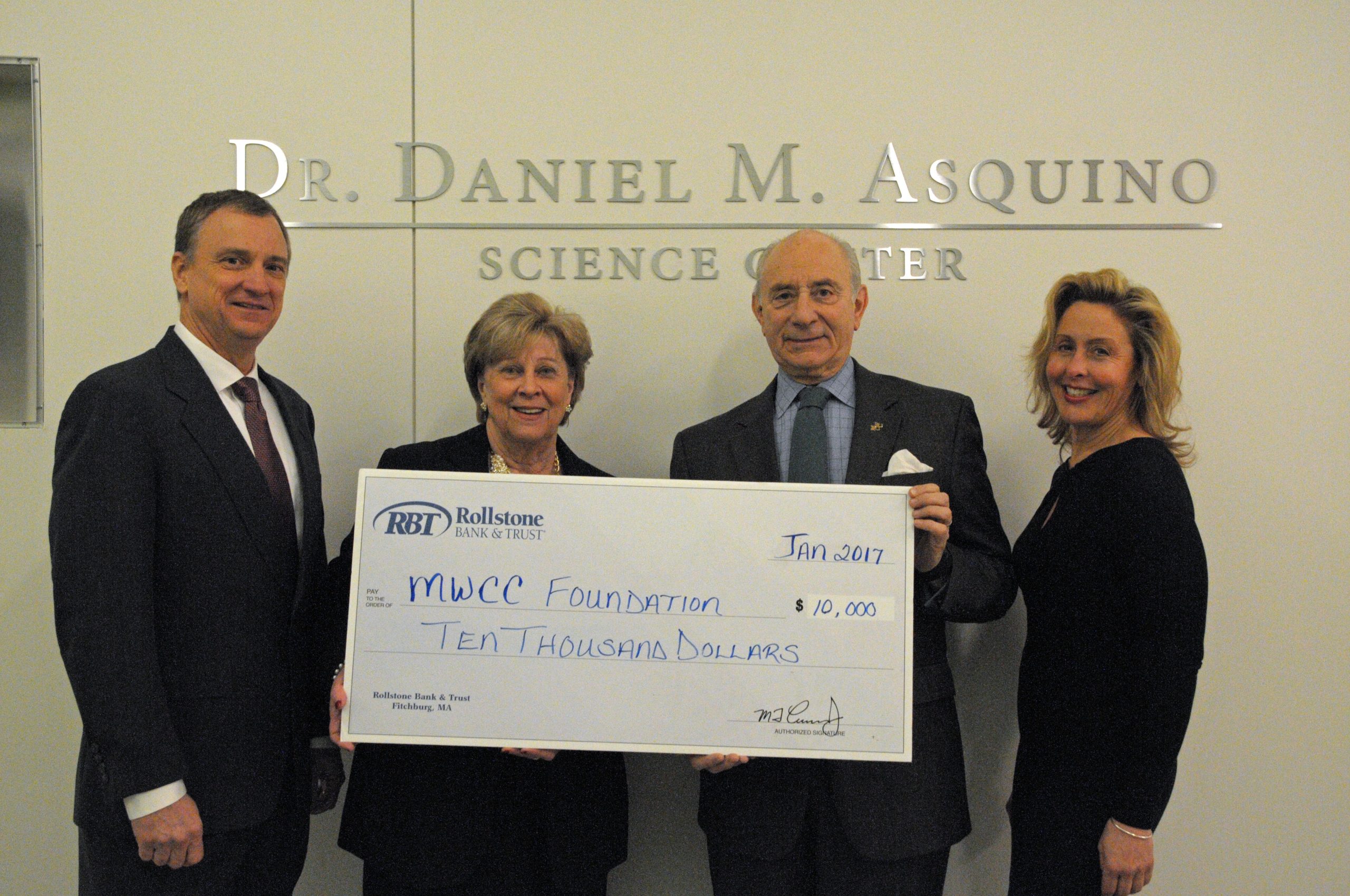 Arthur Feehan and Linda L. Racine presenting a check to President Daniel Asquino and Carla Zottoli