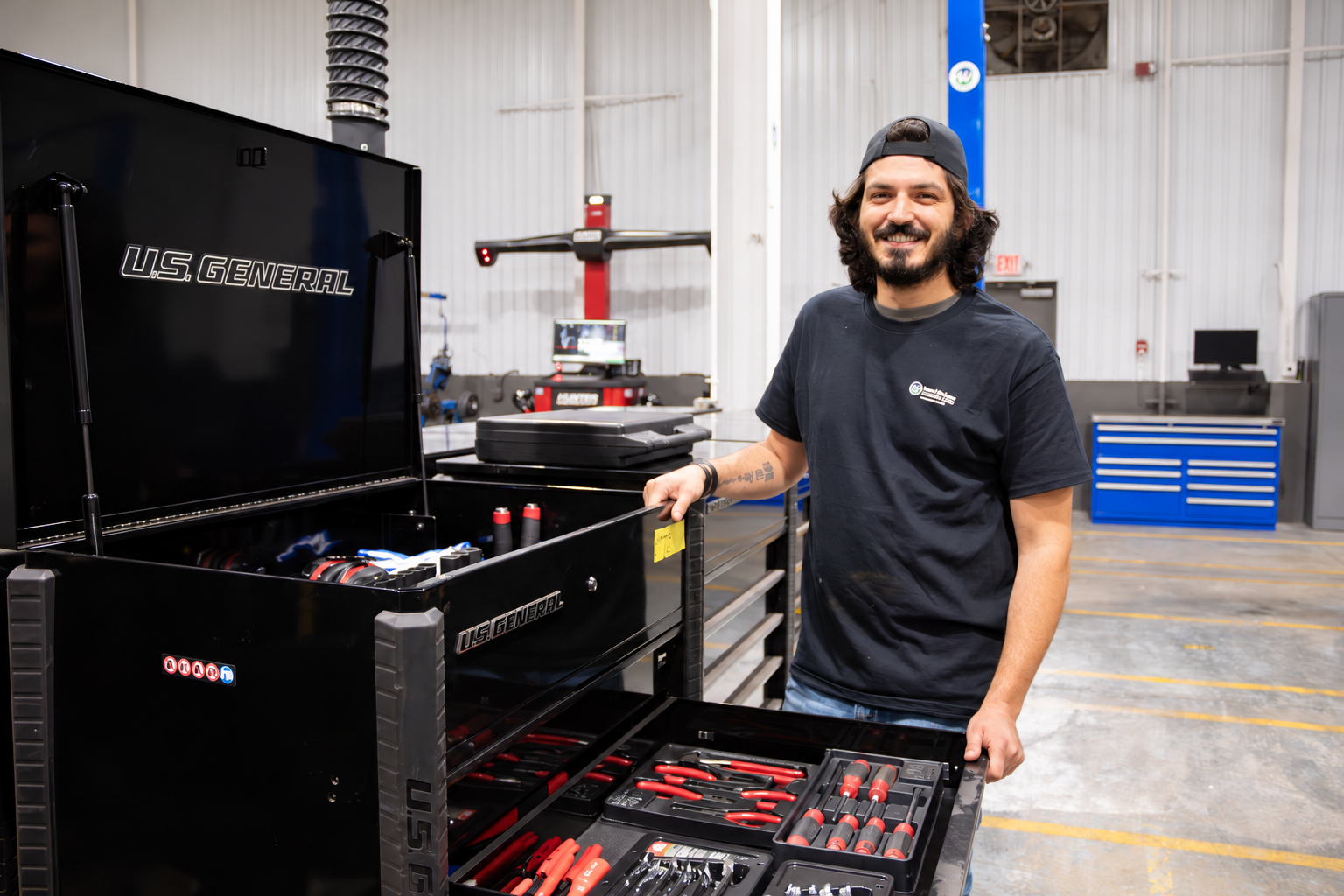 Smiling Mechanic Beside U.S. General Chest