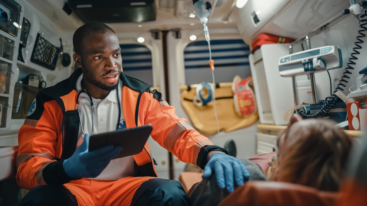 Black,African,American,Ems,Professional,Paramedic,Using,Tablet,Computer,To