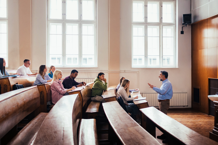 University Lecture Hall with Engaged Students and Professor