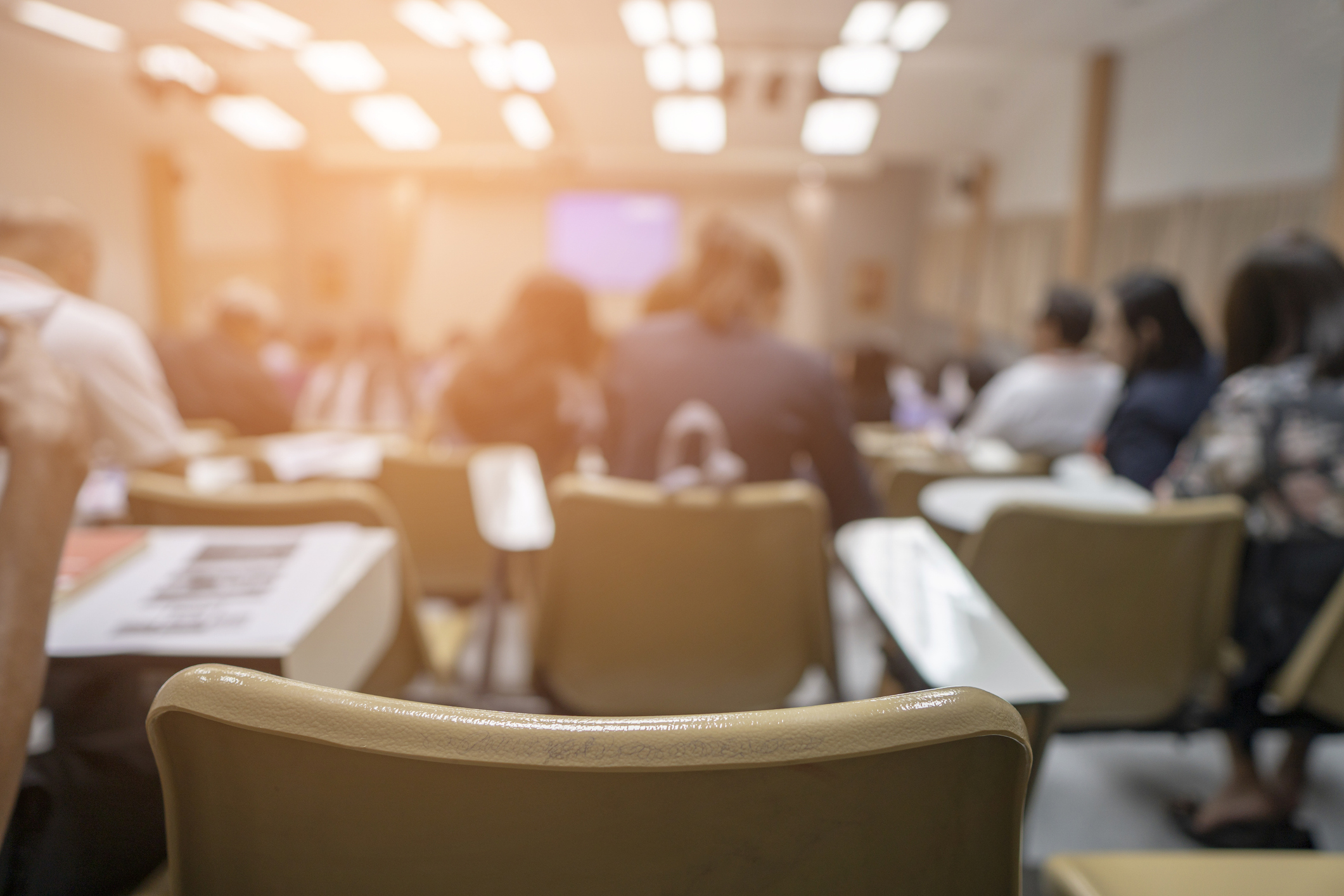 Defocused Image Of People At Auditorium