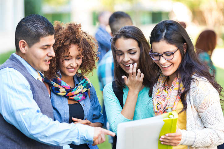 Professor talking to diverse group of high school girls