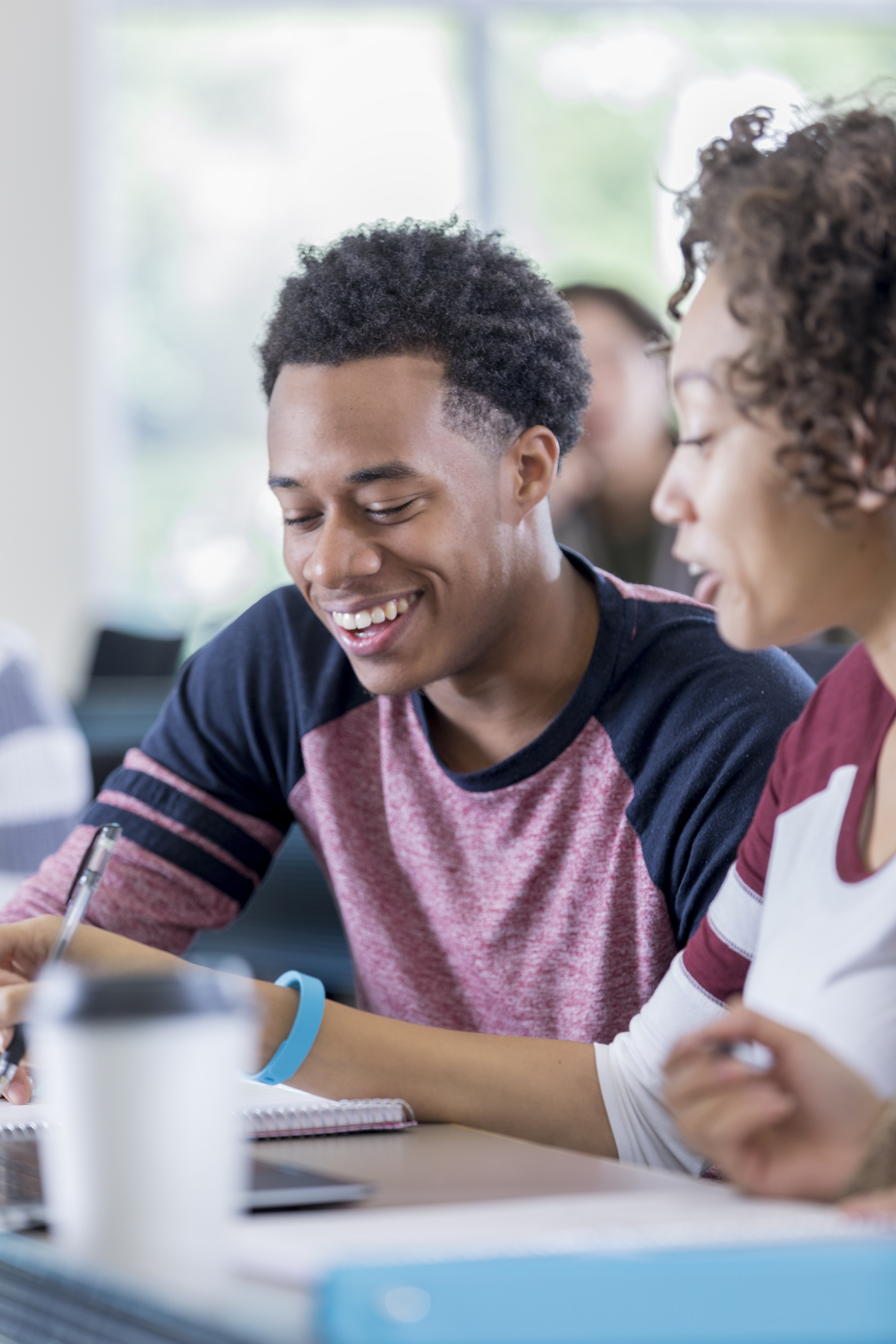 African American college students enjoy working on class assignment