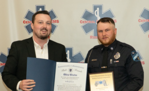 Dan Hickey, District Director, Office of State Senator Peter J. Durant and Officer Caleb Matson of the Templeton Police Department