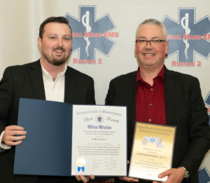 Dan Hickey, District Director, Office of State Senator Peter J. Durant and MWCC Paramedicine Clinical Coordinator John Breshnahan, MPA, NRP, I/C