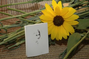 Sunflower with photo of a drawn photo of Carrie Progren