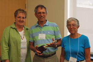 Philip DeCharles receiving his award from Carolyn Rogers and Dr. Diane Goldsmith