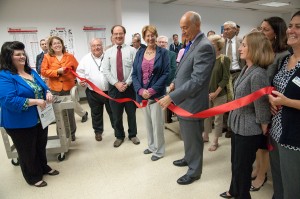 Group cutting the red ribbon in the Devens campus