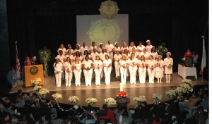 Formal group shot of practical nursing group in their white uniforms