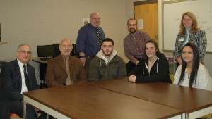 LHS superintendent, teacher and students with MWCC administrators around a table