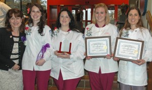 A group of dental students in their uniforms