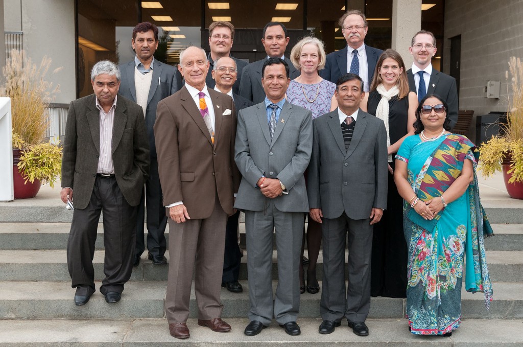 Group of college administrators in front of the entrance to MWCC