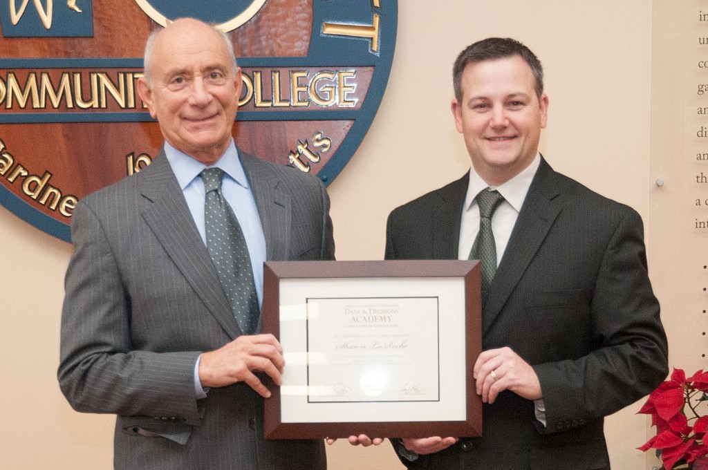 President Dan Asquino and Shawn LaRoche holding his certificate of completion