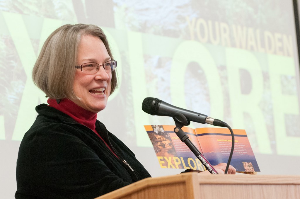 MWCC student Susan Shute displays a brochure of pictures she took at North Pack Monadnock, her personal "Walden." Shute was one of several students who showcased Thoreau-inspired projects as part of "East Meets West in a Cabin in Concord."