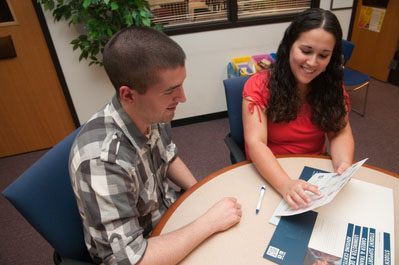 Staff member advising a student