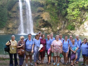 Group photo of nursing students/chaperones in front of a waterfall in Haiti