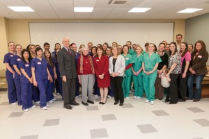 Large group of dental students, faculty and president asquino