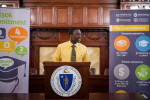 Student Luis Ayisi speaking at a podium