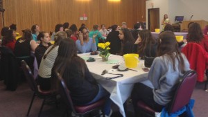 View of the room full of students listening to the speaker at the podium